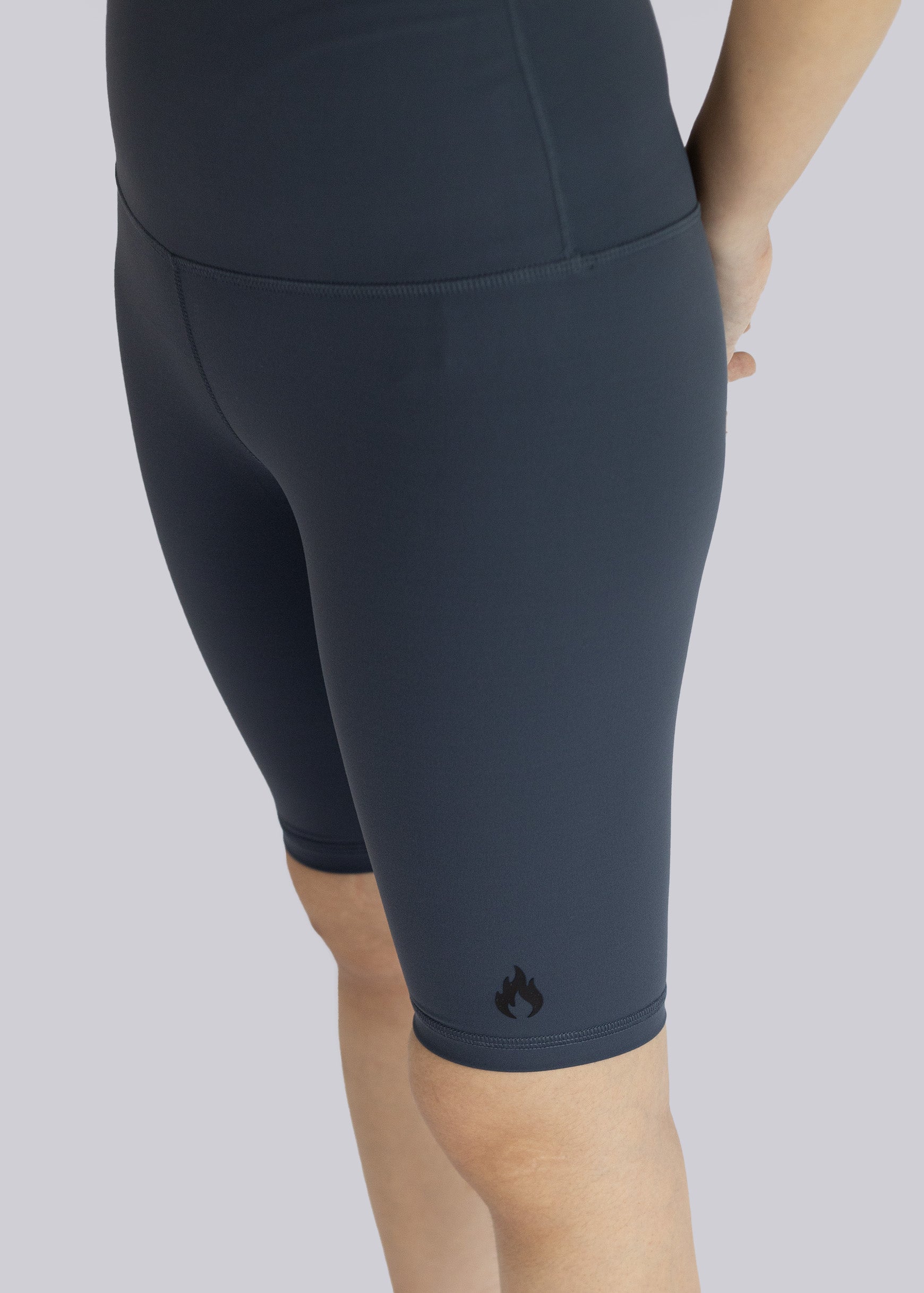 Dark gray athletic shorts on a plain background