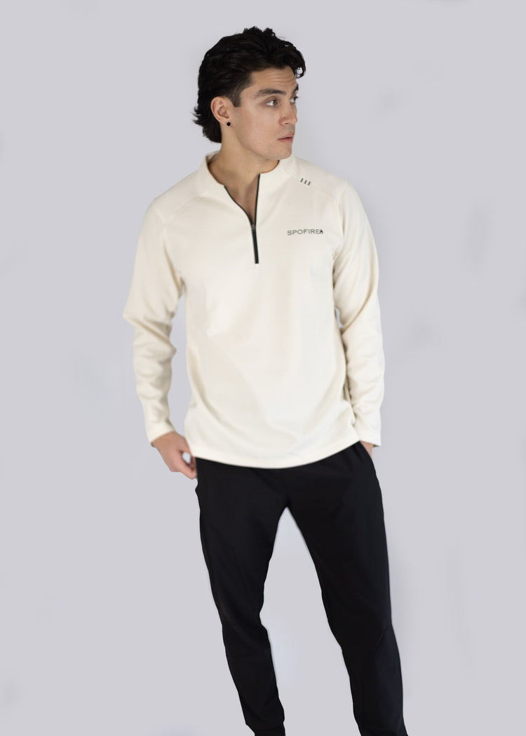 A model wearing off white sweater with a Spofire logo on a light gray background